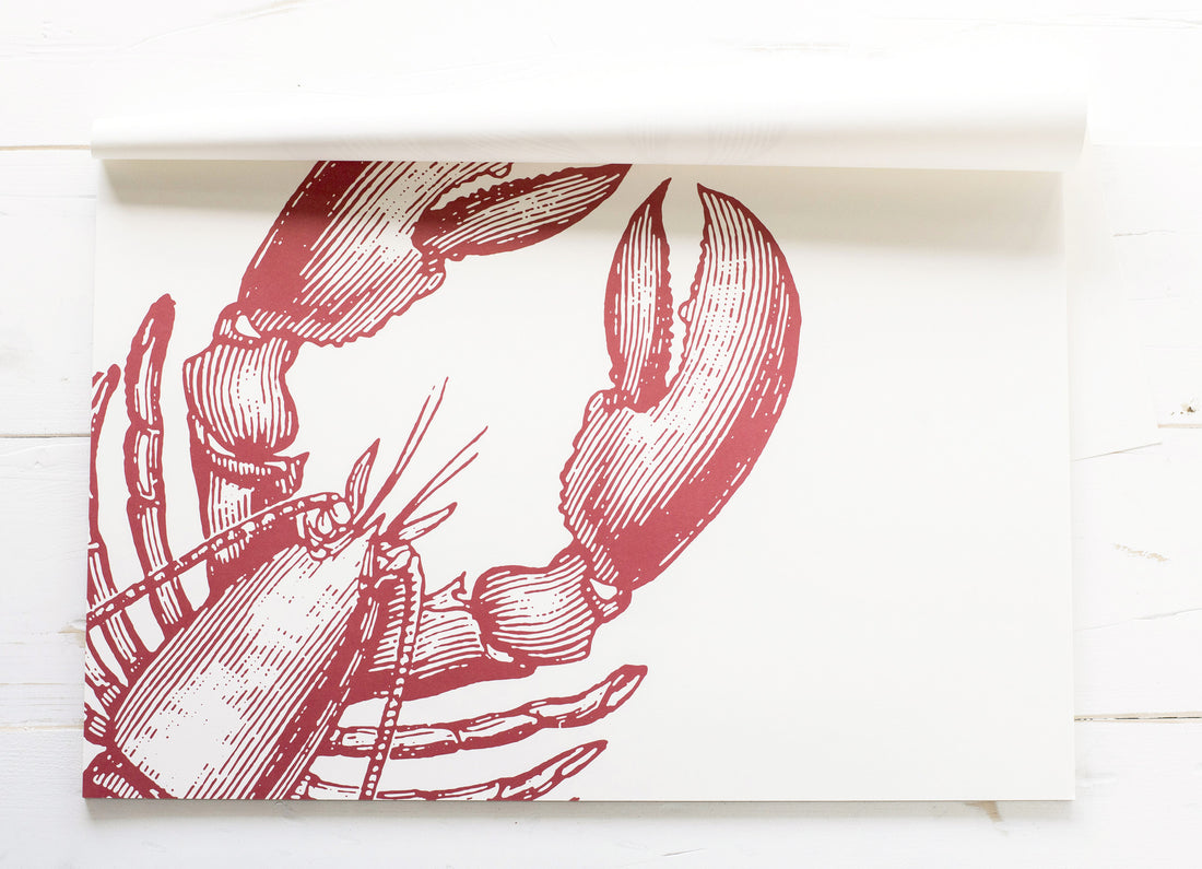 An engraving-style illustration of a large lobster&