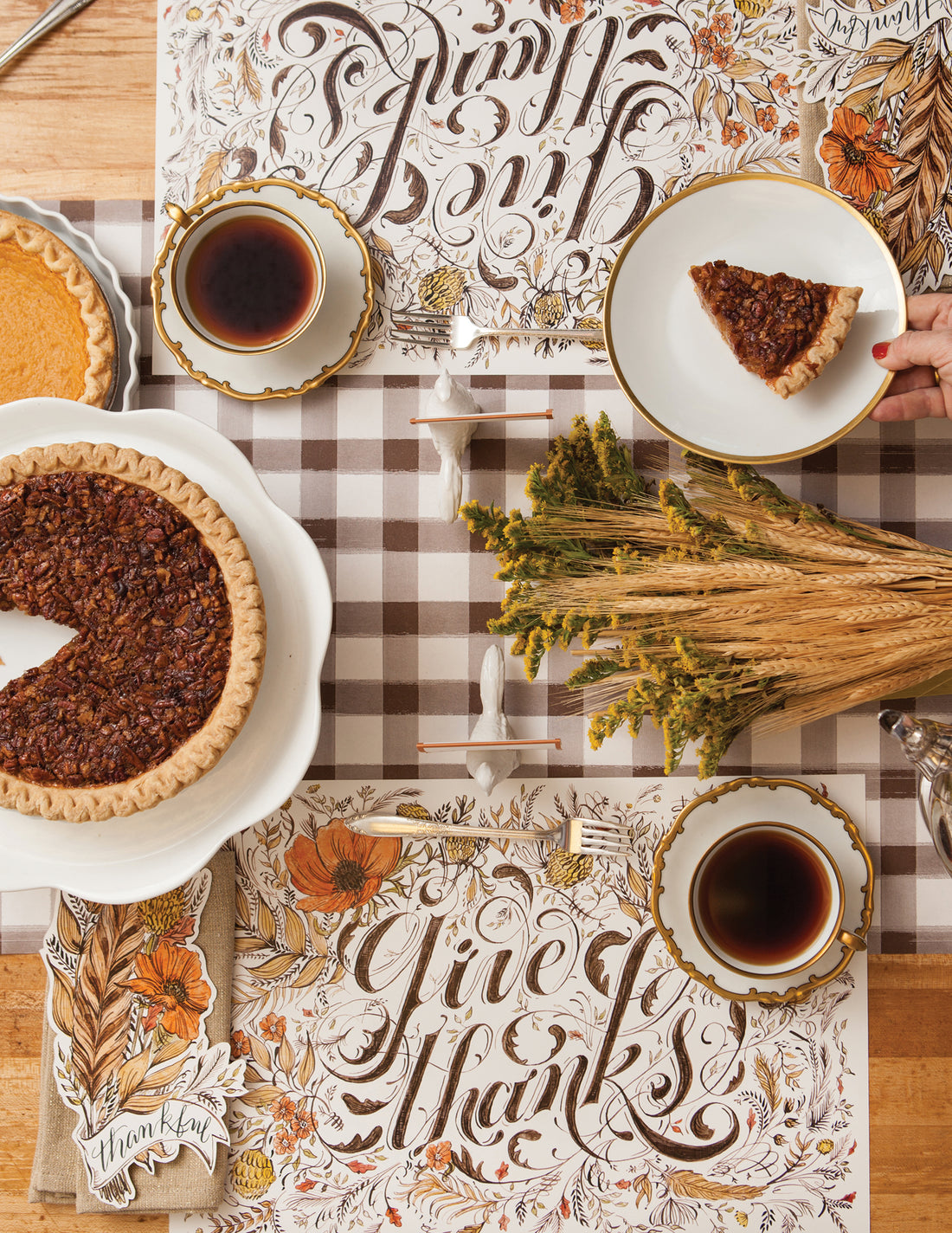 Top-down view of the Give Thanks Placemat in an elegant fall-themed table setting for two. 