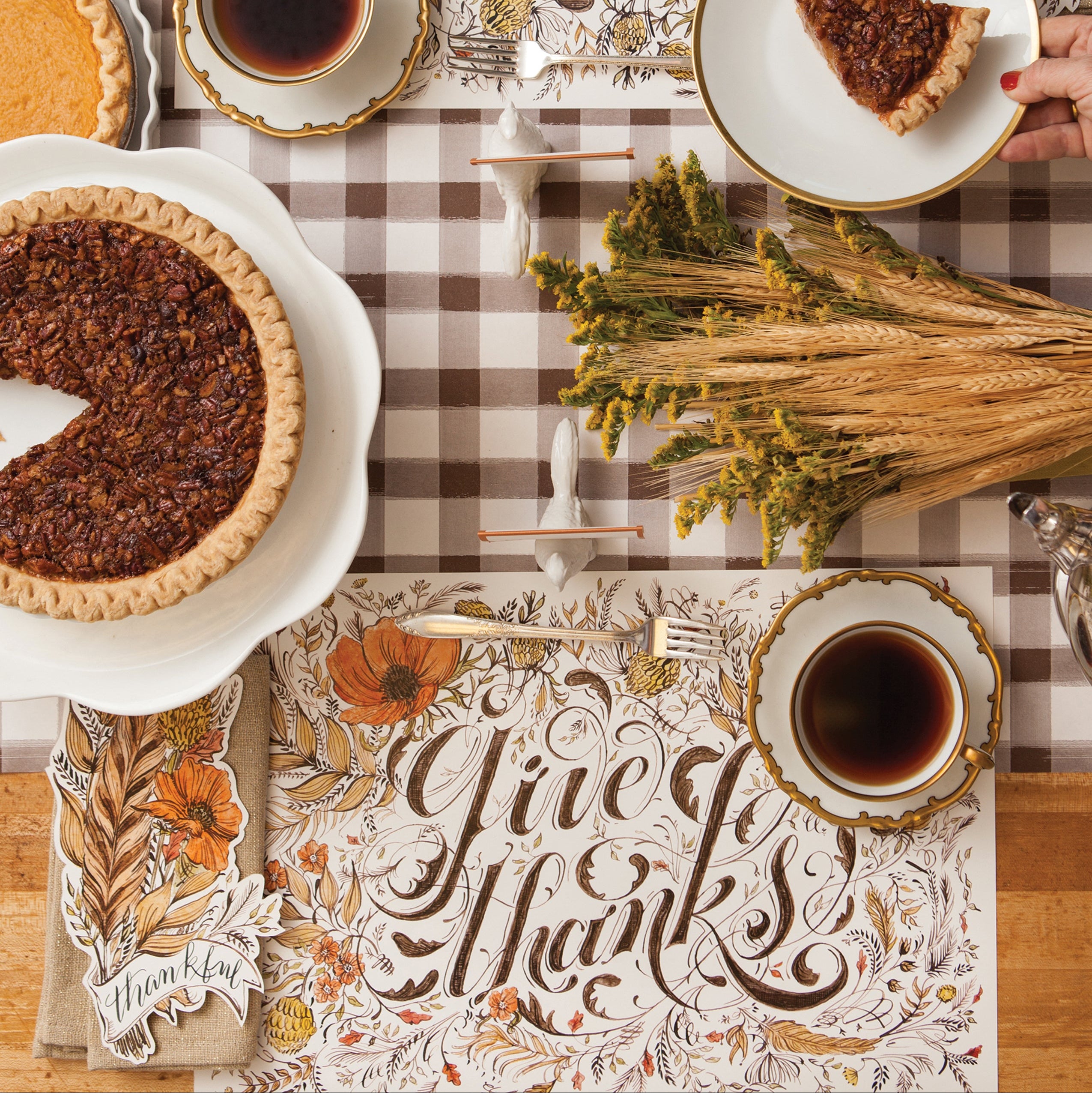 Top-down view of the Give Thanks Placemat in an elegant fall-themed table setting for two.