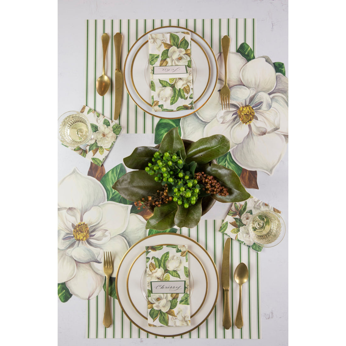 The Green Ribbon Stripe Placemat under an elegant table setting for two, from above.