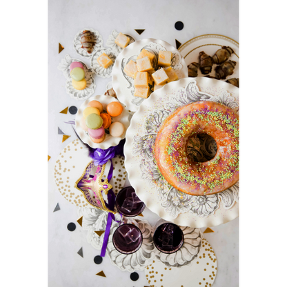 A Mardi Gras-themed treat table featuring Gold Serving papers.