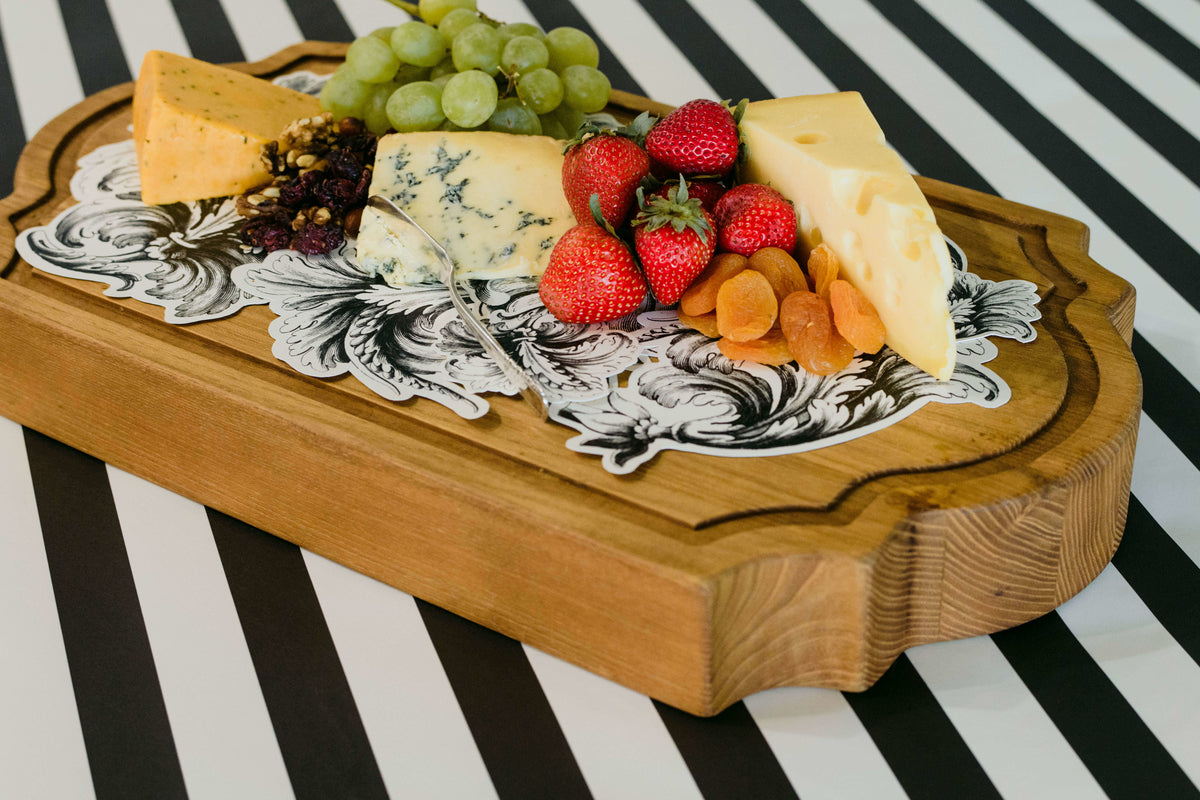The Flourish Serving Confetti under an elegant charcuterie board.