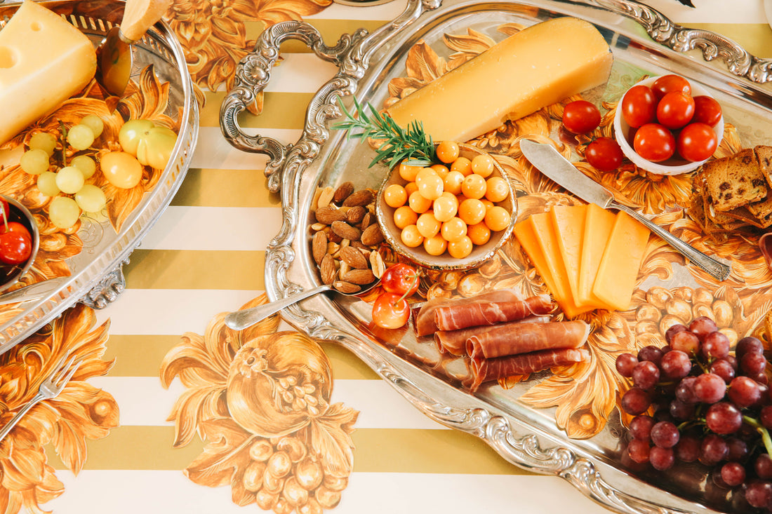 The Gold Classic Stripe Runner under an elegant charcuterie spread.