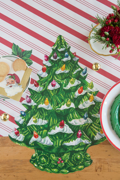 The Die-cut Vintage Christmas Tree Placemat as decoration on a Christmas-themed tablescape. 