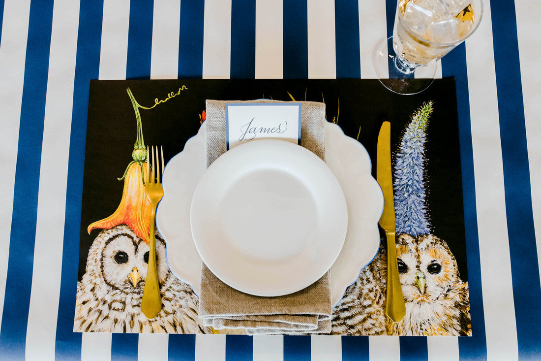 The Baby Owls Placemat used in a place setting over a Navy Stripe Runner.