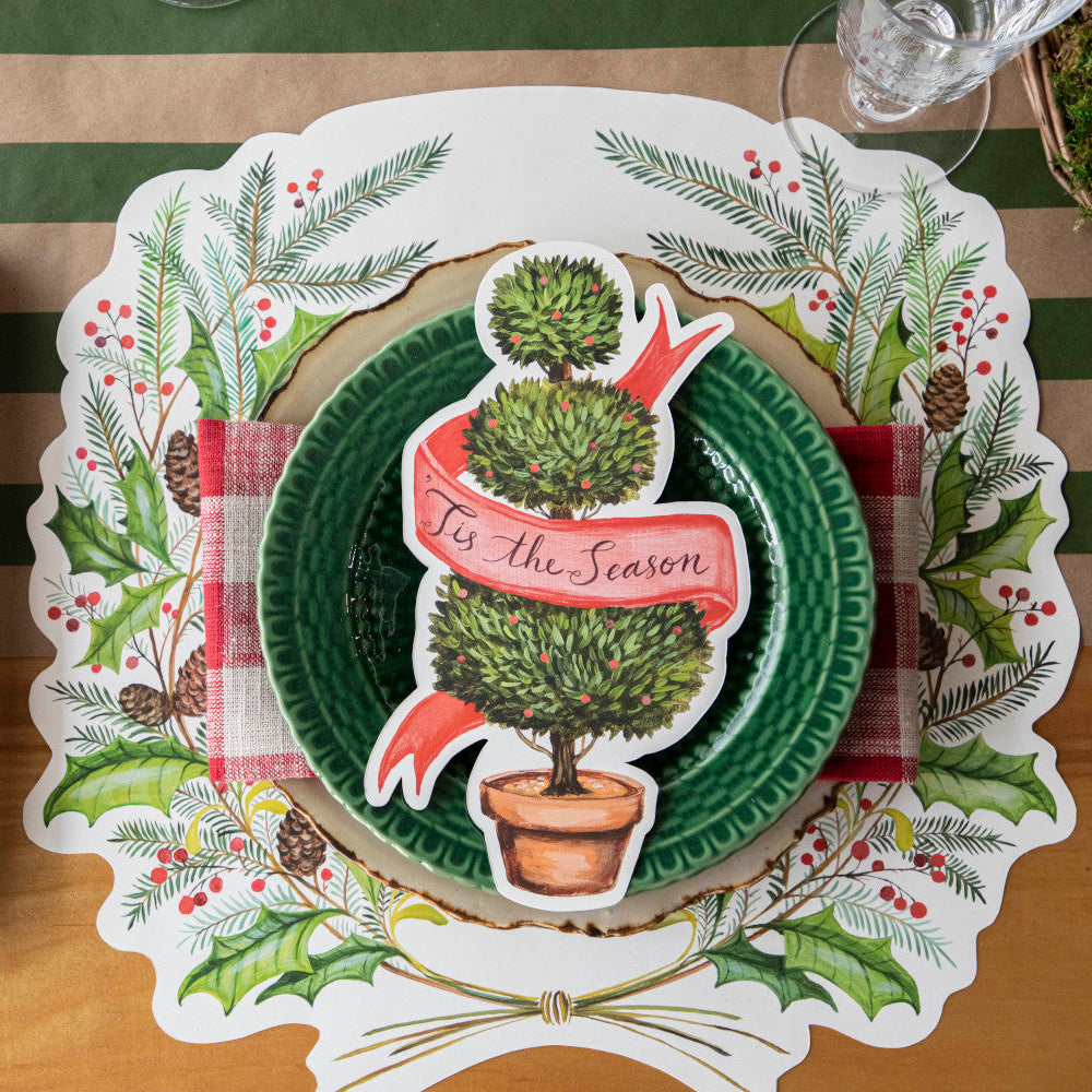 The Die-cut Christmas Sprigs Placemat under a festive holiday place setting.