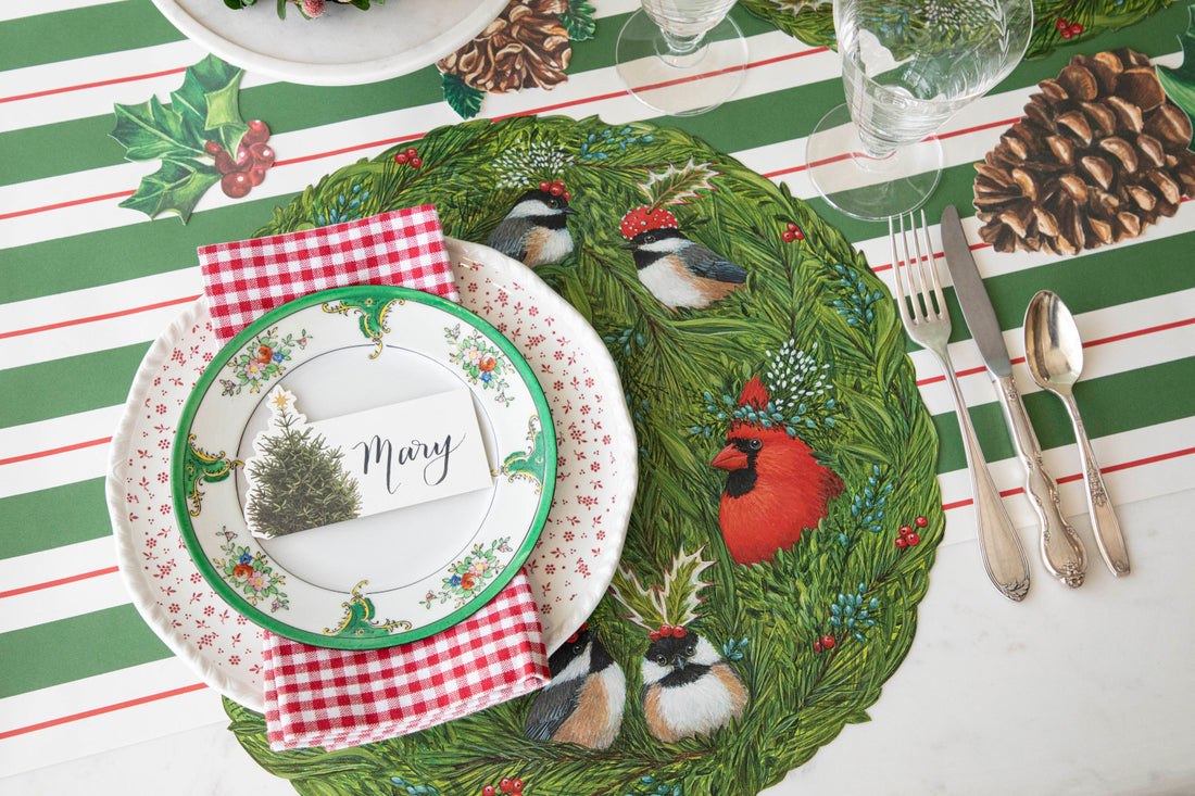 The Die-cut Winter Songbirds Placemat under a festive winter-themed place setting.