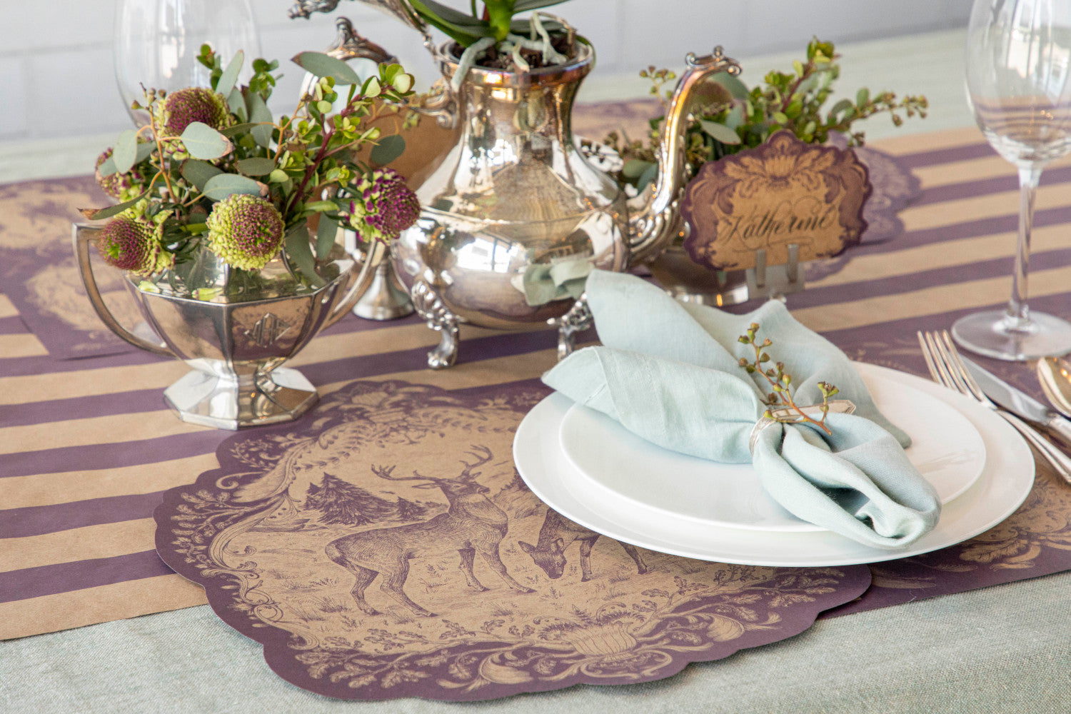 An elegant table setting featuring beautifully arranged plates and silverware showcasing the Hester &amp; Cook Kraft Purple Stripe Runner for entertaining.