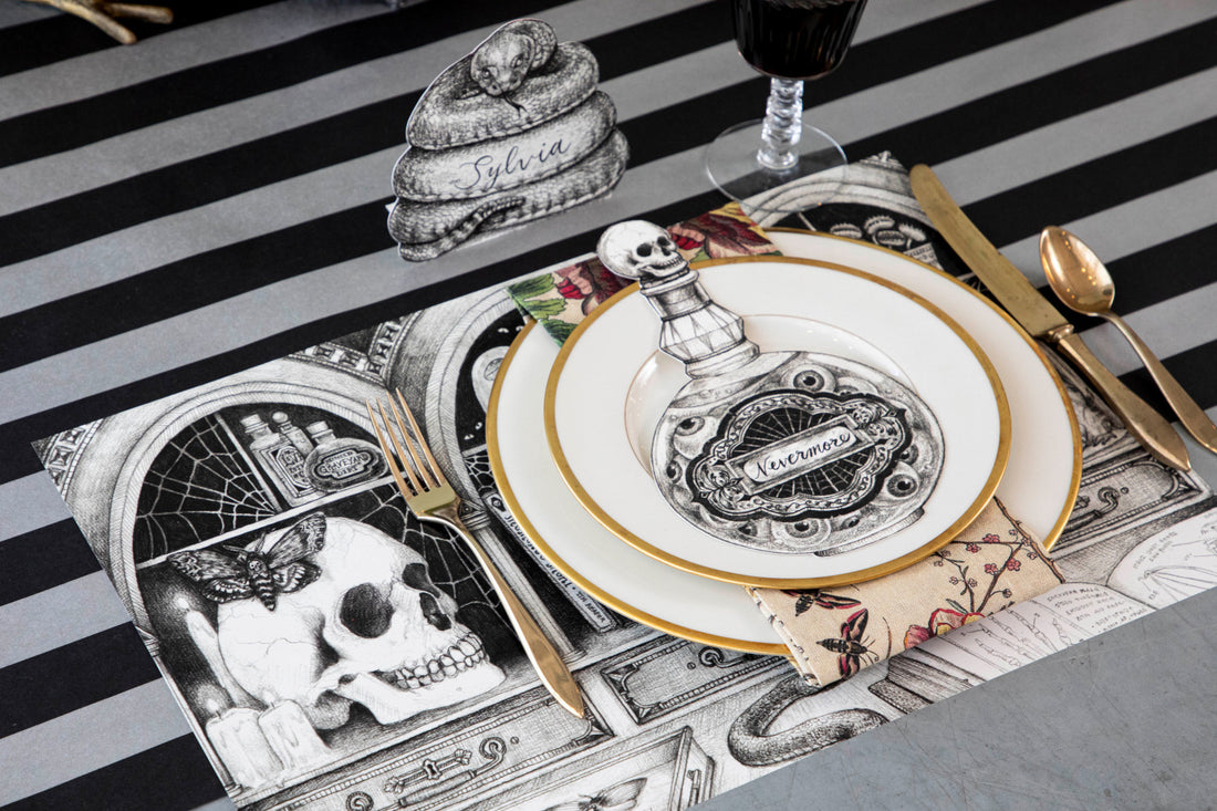 The Chalkboard Silver Stripe Runner under a spooky Halloween-themed place setting.