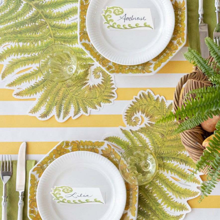 A Marigold Classic Stripe Runner from Hester & Cook under an elegant fern-themed table setting, from above.