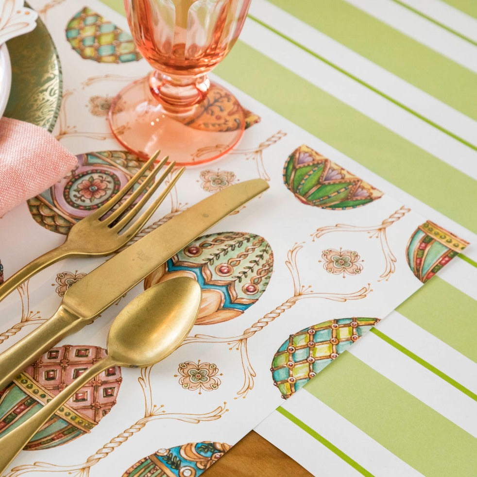 Close-up of the Green Awning Stripe Runner under an elegant Easter place setting.