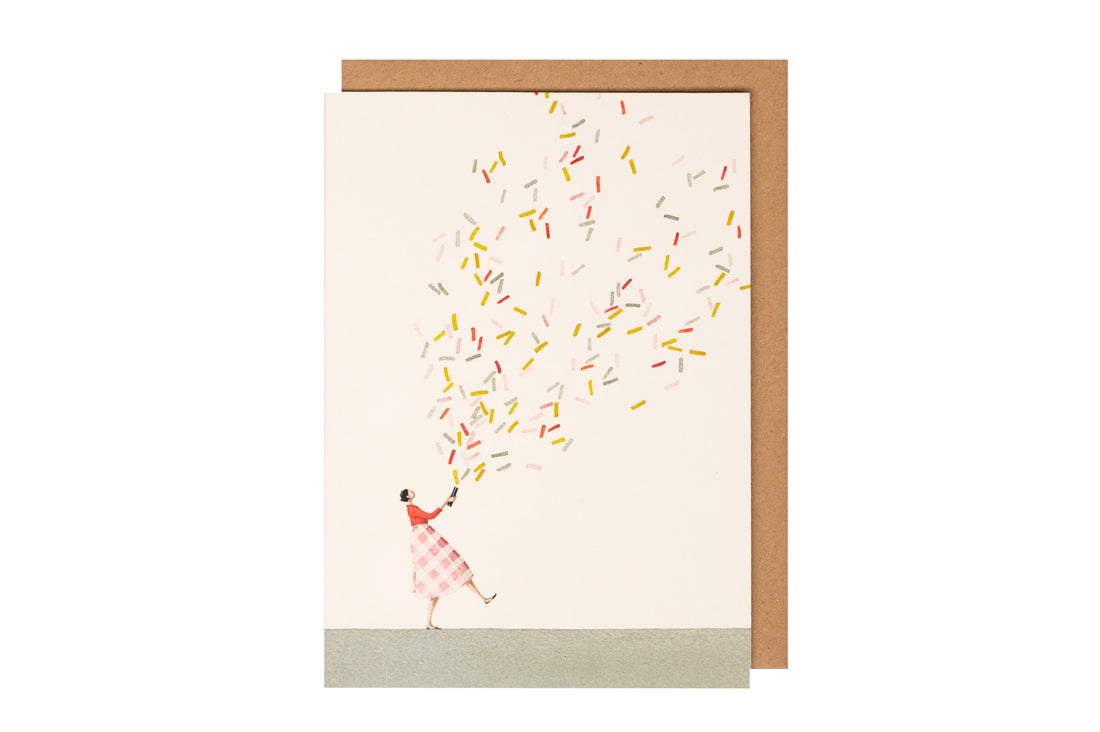 A Glitter Bomb Girl Greeting Card with an environmentally sustainable artwork of a woman flying with confetti by Hester &amp; Cook.