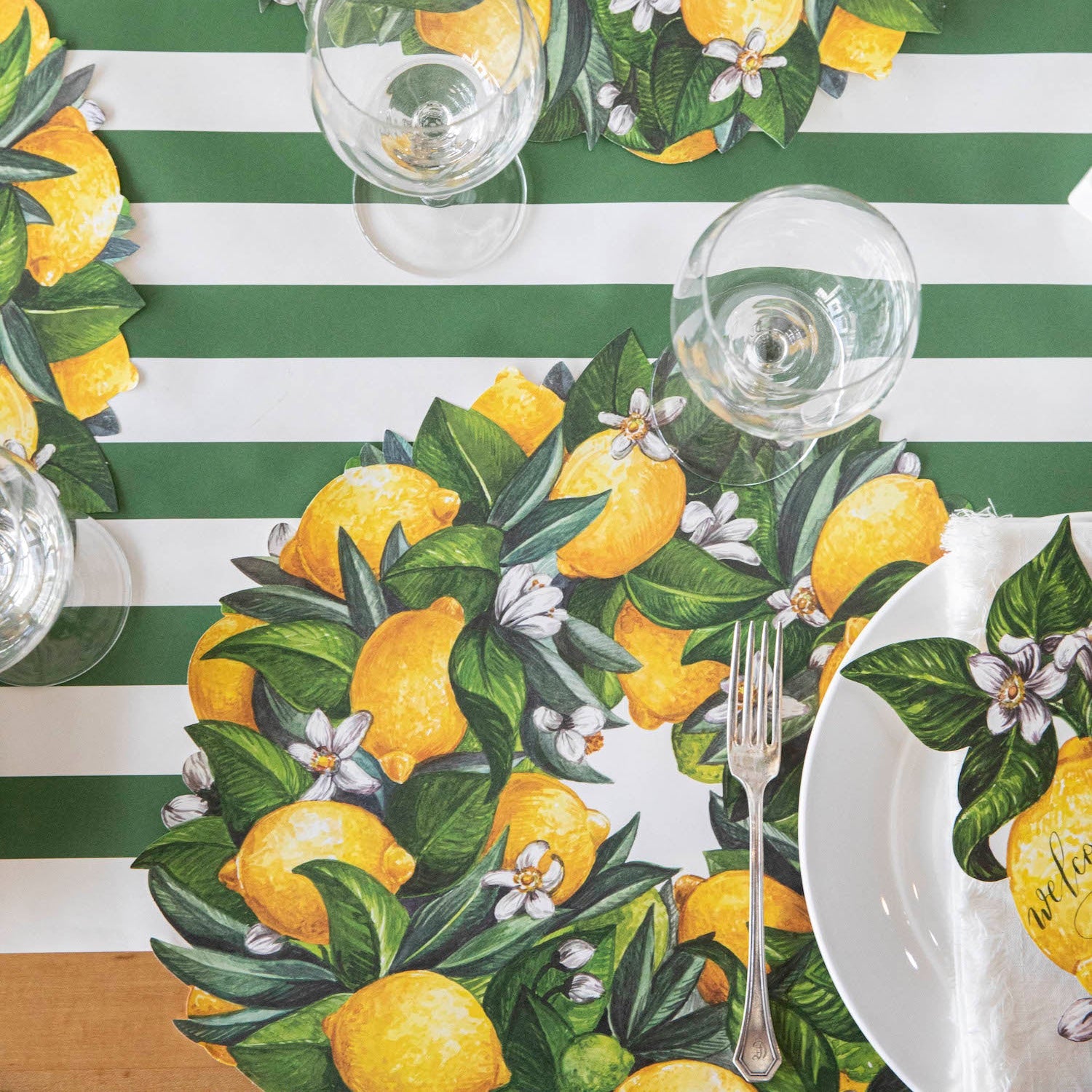 The Die-cut Lemon Wreath under an elegant table setting, from above.
