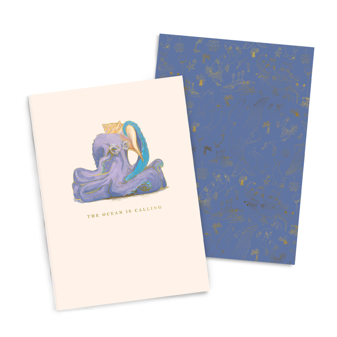 A Good Juju Ink Ocean is Calling Notebook Duo with an illustration of an octopus wearing a crown and the phrase &quot;the ocean is calling&quot; on its cover, beside a patterned blue sheet.