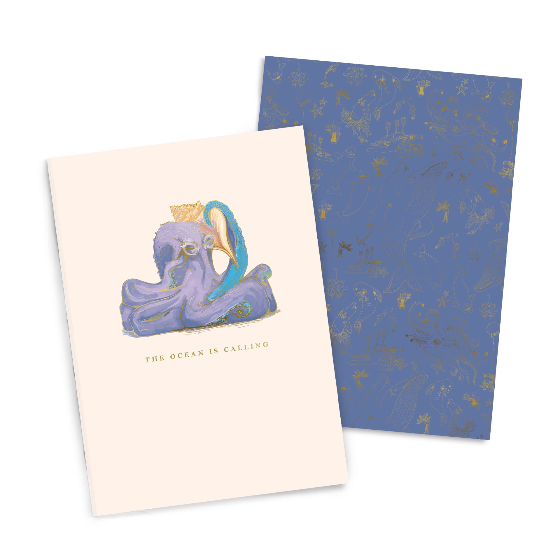 A Good Juju Ink Ocean is Calling Notebook Duo with an illustration of an octopus wearing a crown and the phrase "the ocean is calling" on its cover, beside a patterned blue sheet.