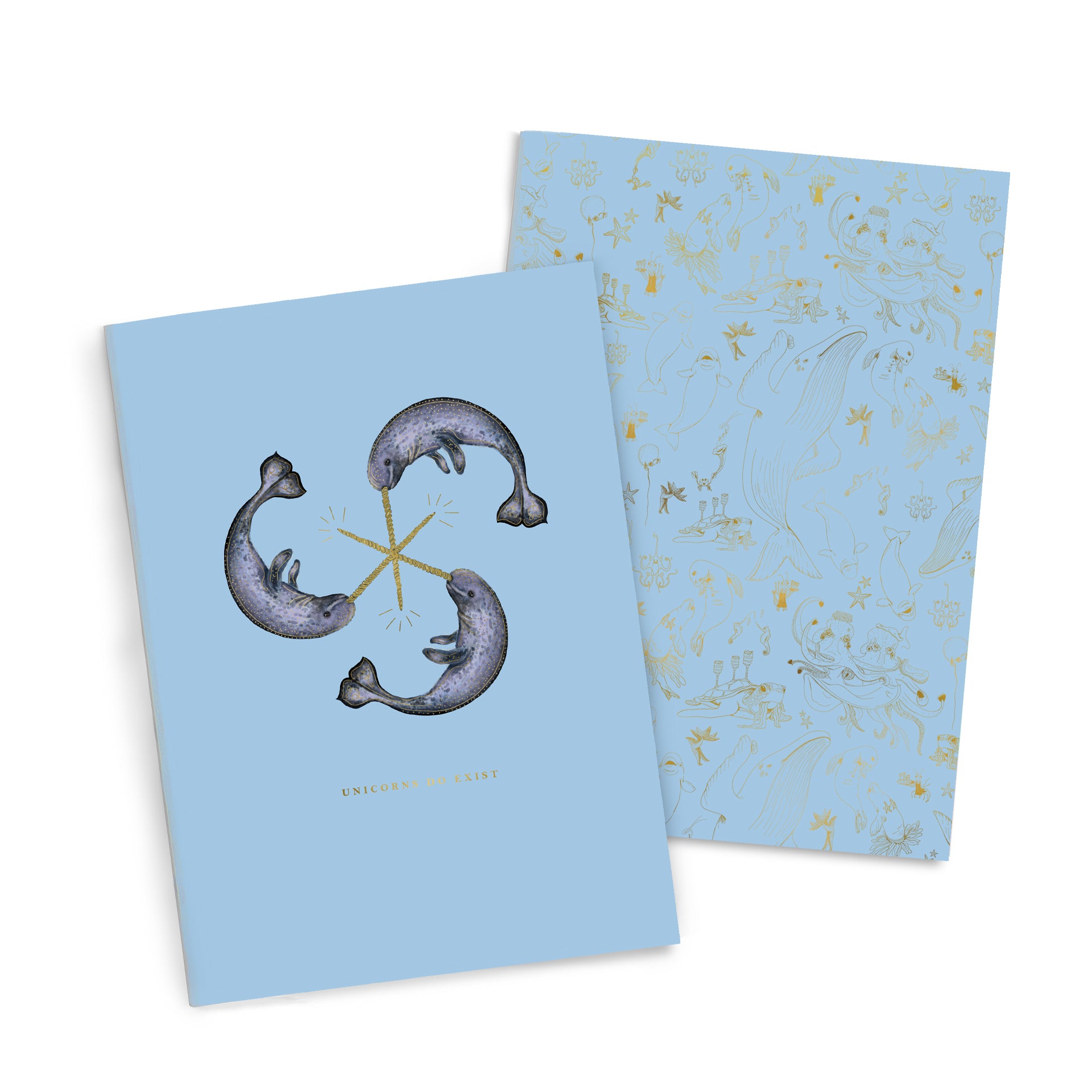 A Narwhal Notebook Duo by Good Juju Ink with two fish and unicorns on it.