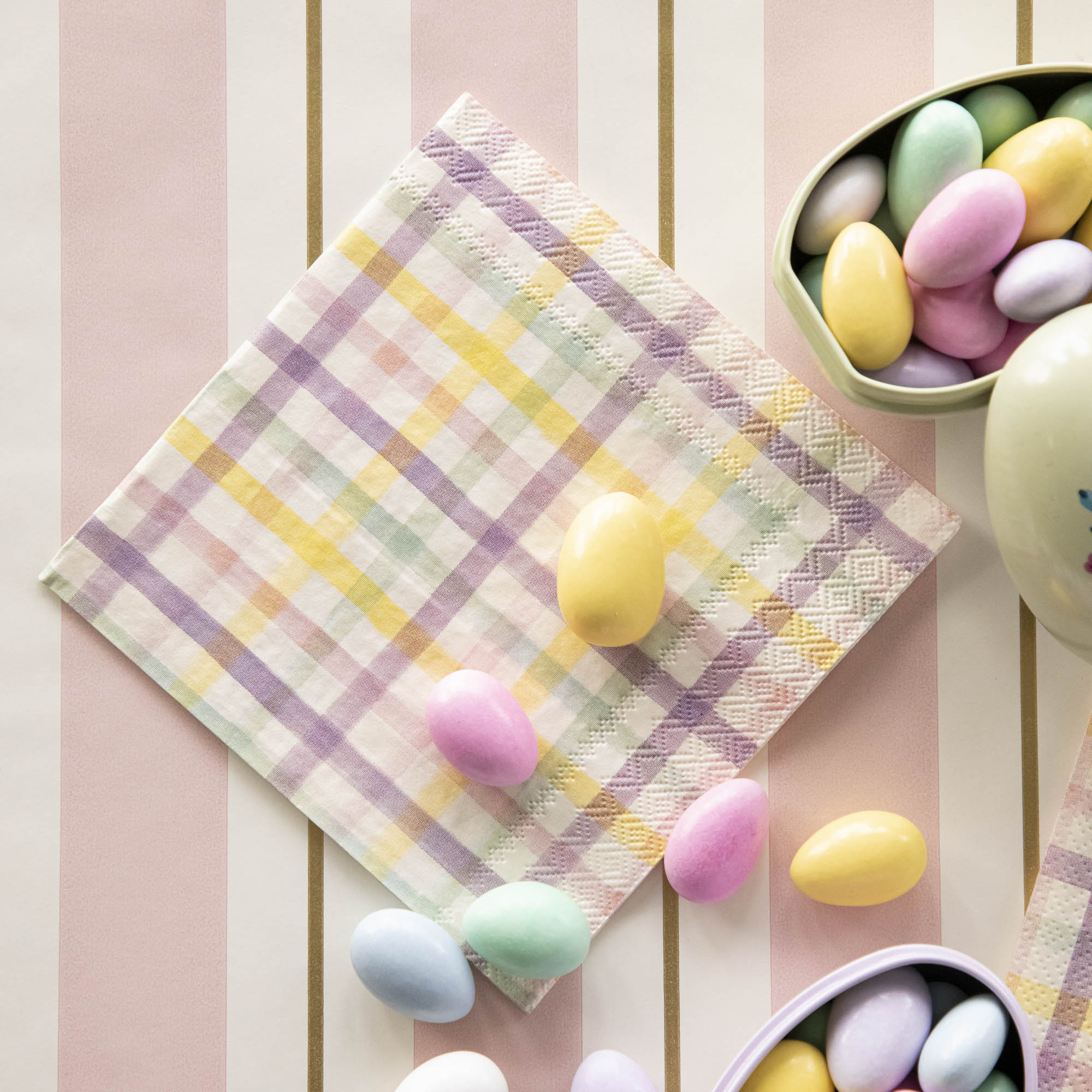 A Spring Plaid Cocktail Napkin with colorful Easter candies.