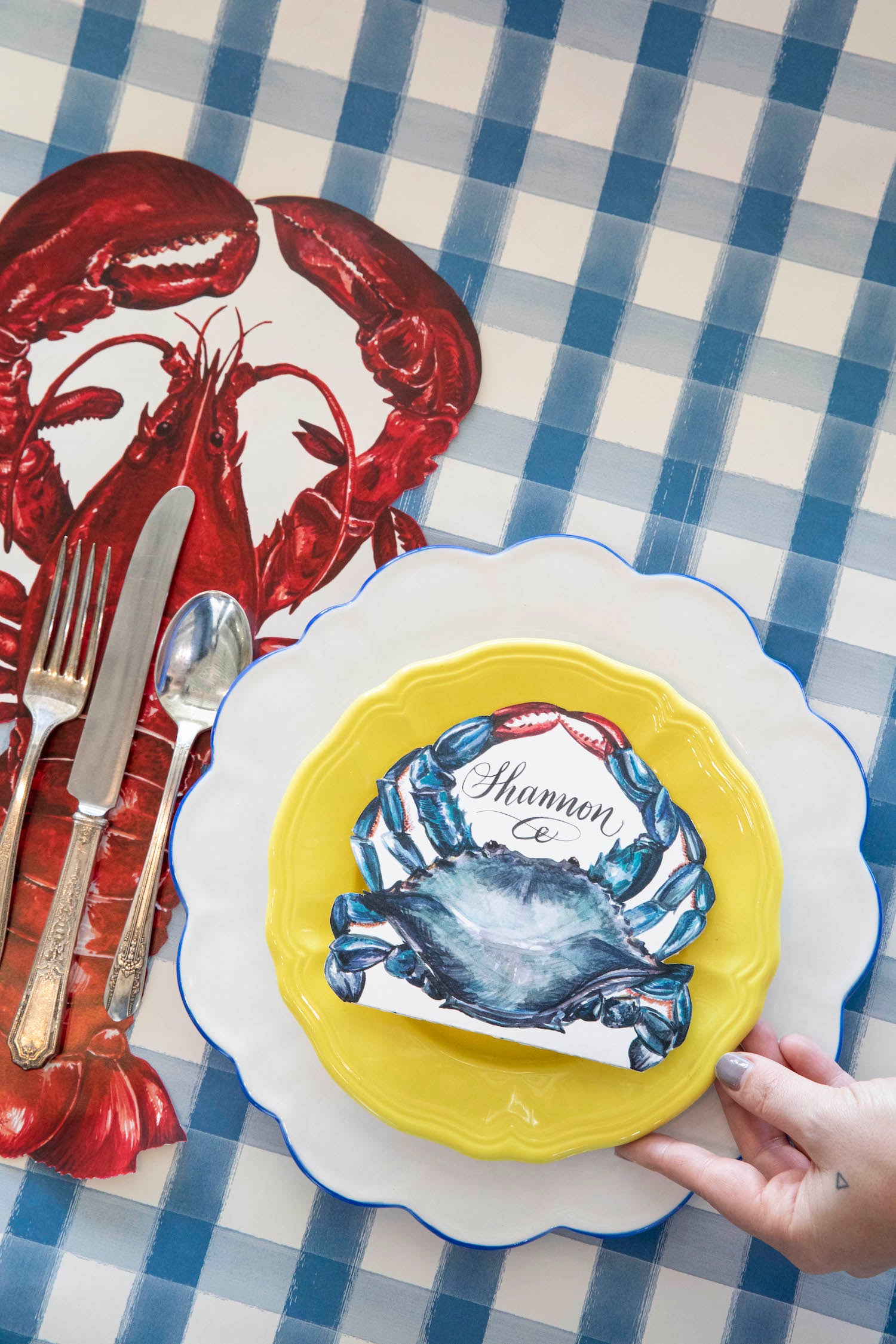 The Die-cut Lobster Placemat under the cutlery in an elegant place setting.