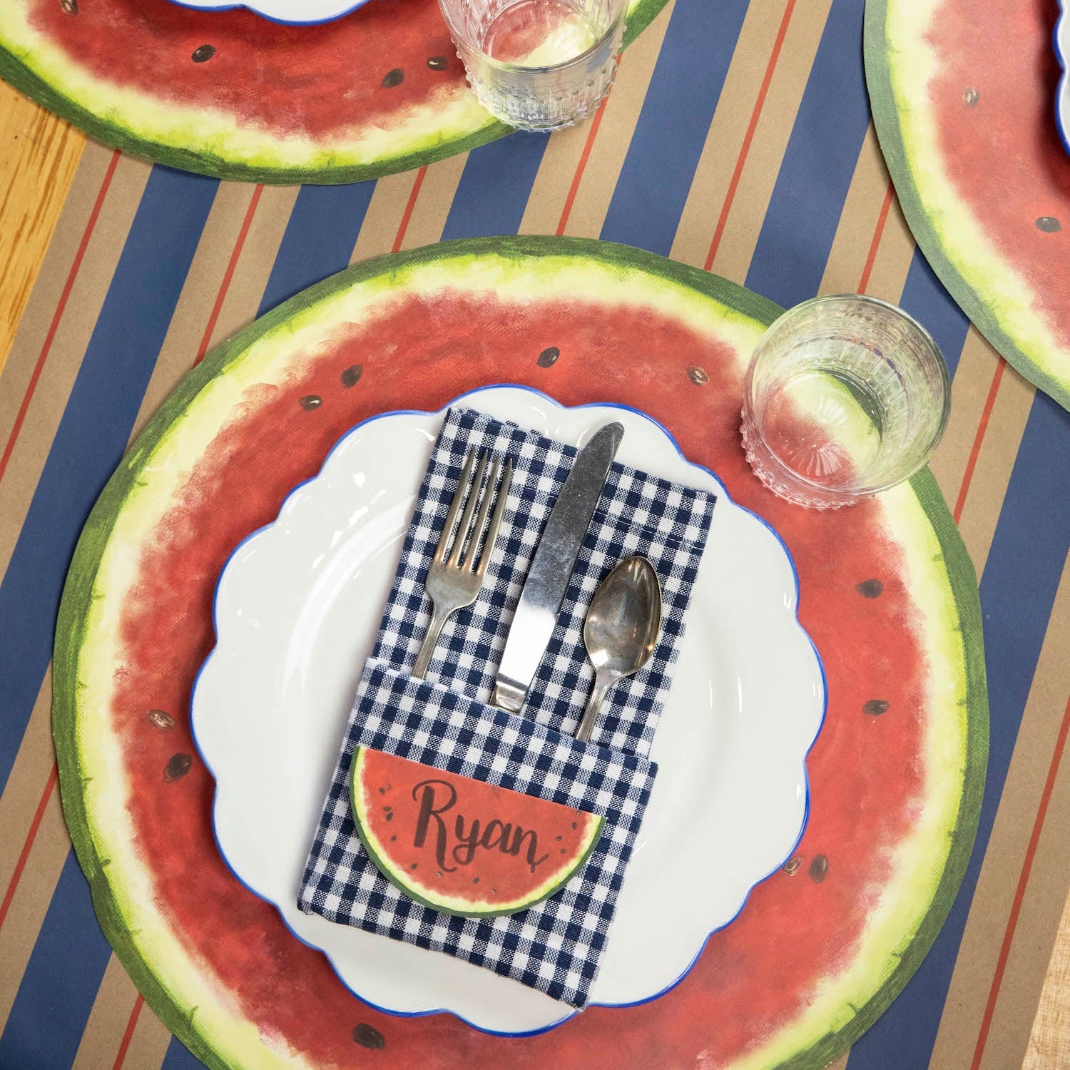 The Kraft Navy & Red Awning Stripe Runner under a summertime table setting.