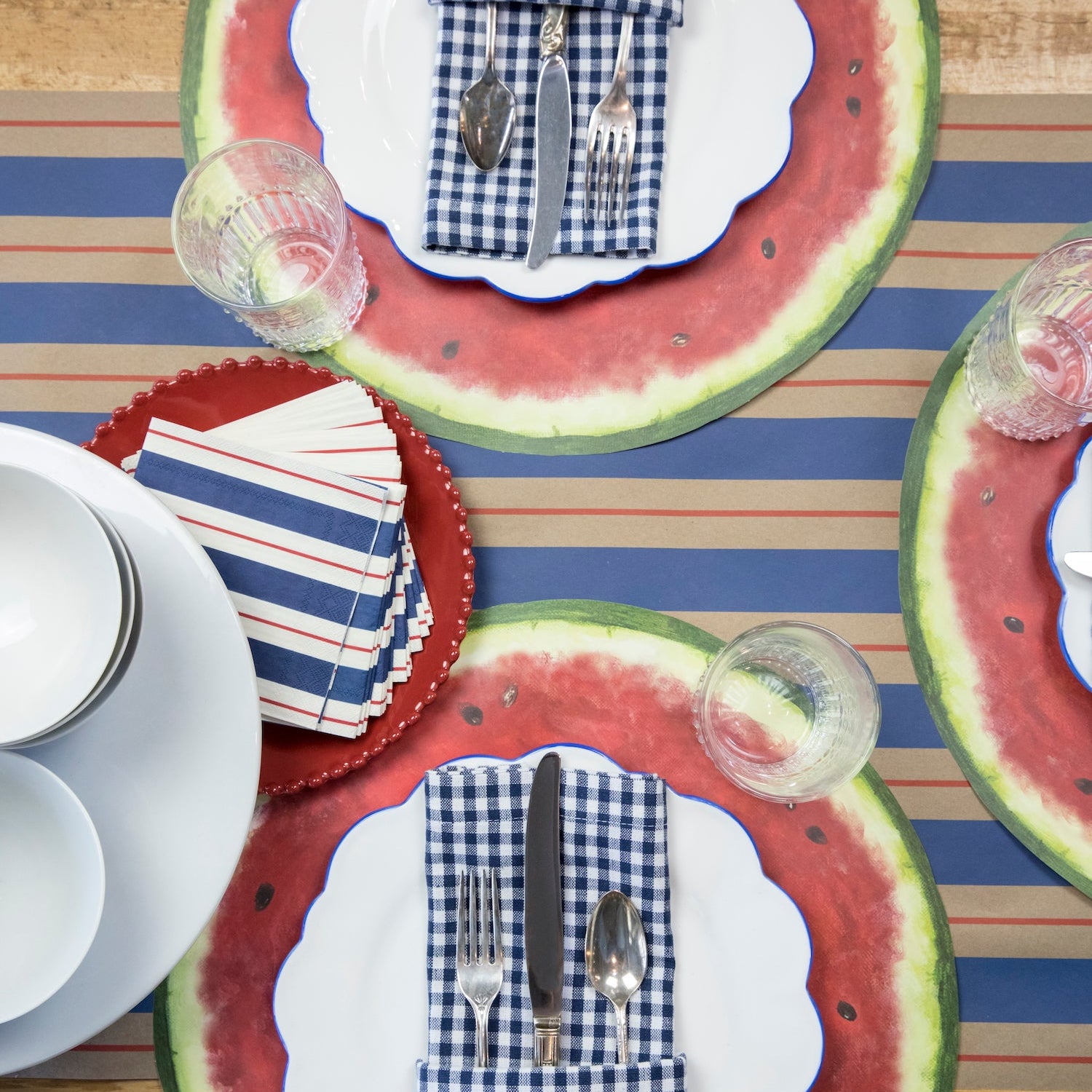 The Kraft Navy & Red Awning Stripe Runner under a summertime table setting, from above.