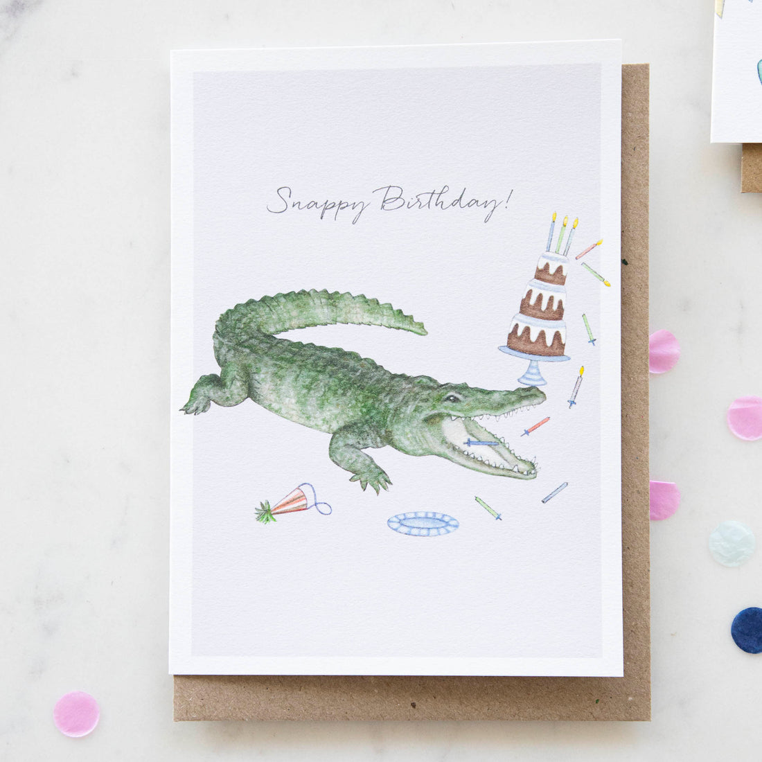 A whimsical, hand-drawn Lottie Murphy Crocodile Birthday Card with a crocodile on it.