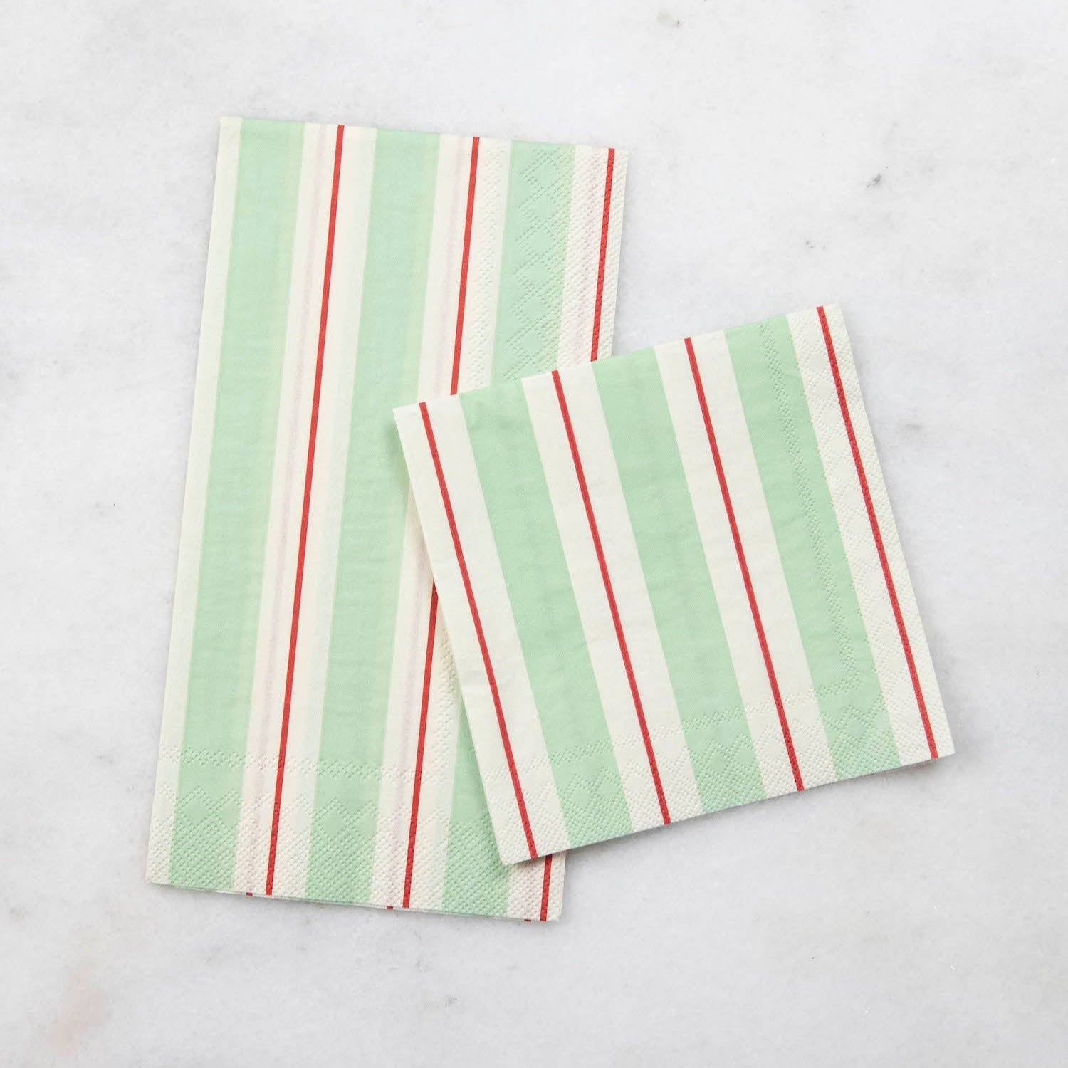 Two Seafoam & Red Awning Stripe Napkins, one Guest and one Cocktail, by Hester & Cook on a table.