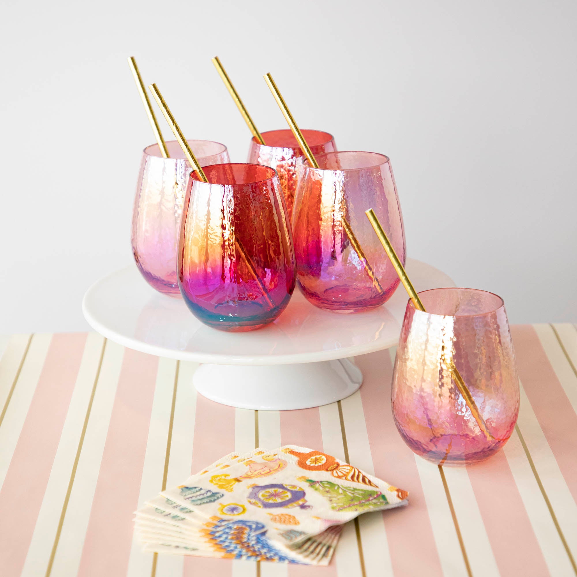 A set of Luster Stemless Glassware by Zodax consisting of stemless all purpose glasses, elegantly arranged on a home table.