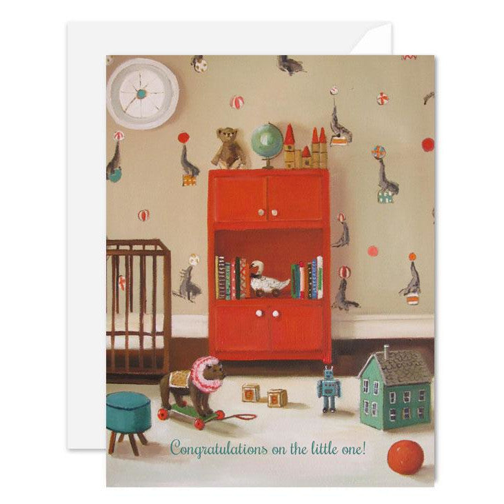 A whimsical Nursery Seals Card, illustrated by Janet Hill, featuring a nursery scene with floating objects and the message &quot;Congratulations on the little one!