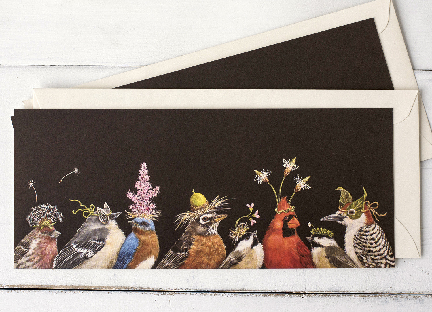 A row of colorful birds with leaves on their heads, featuring Hester &amp; Cook&