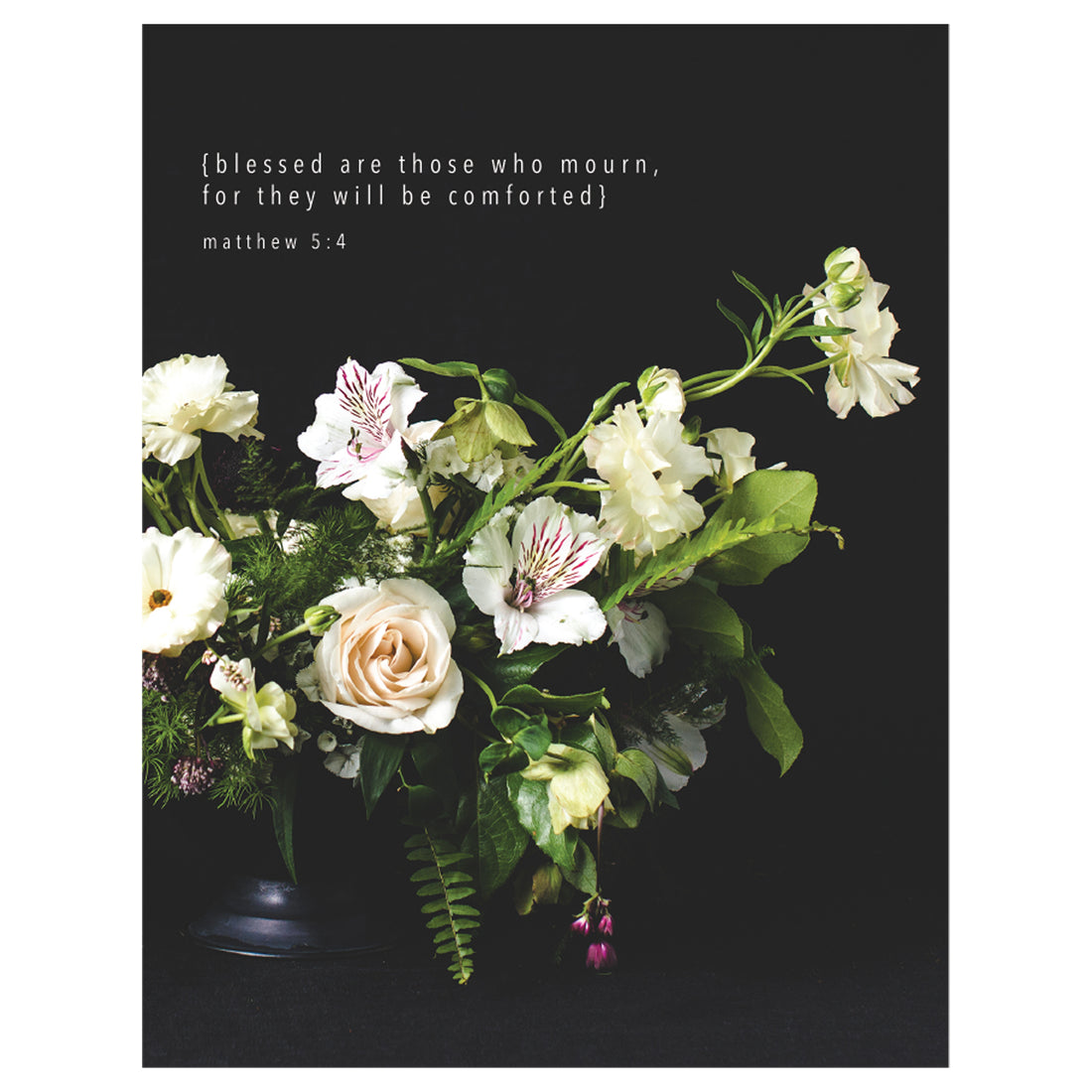 A photo of a bouquet of white flowers with vibrant green leaves in a black vase on a black background, with &quot;{blessed are those who mourn, for they will be comforted} matthew 5:4&quot; printed in white above the flowers.