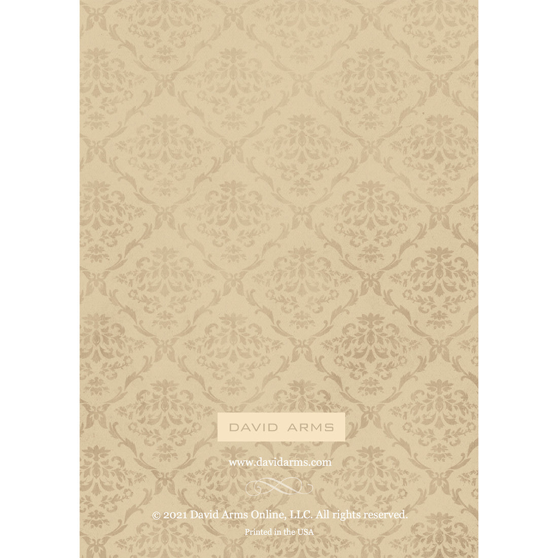 The beige damask patterned back side of the greeting card, featuring the name of the artist David Arms.