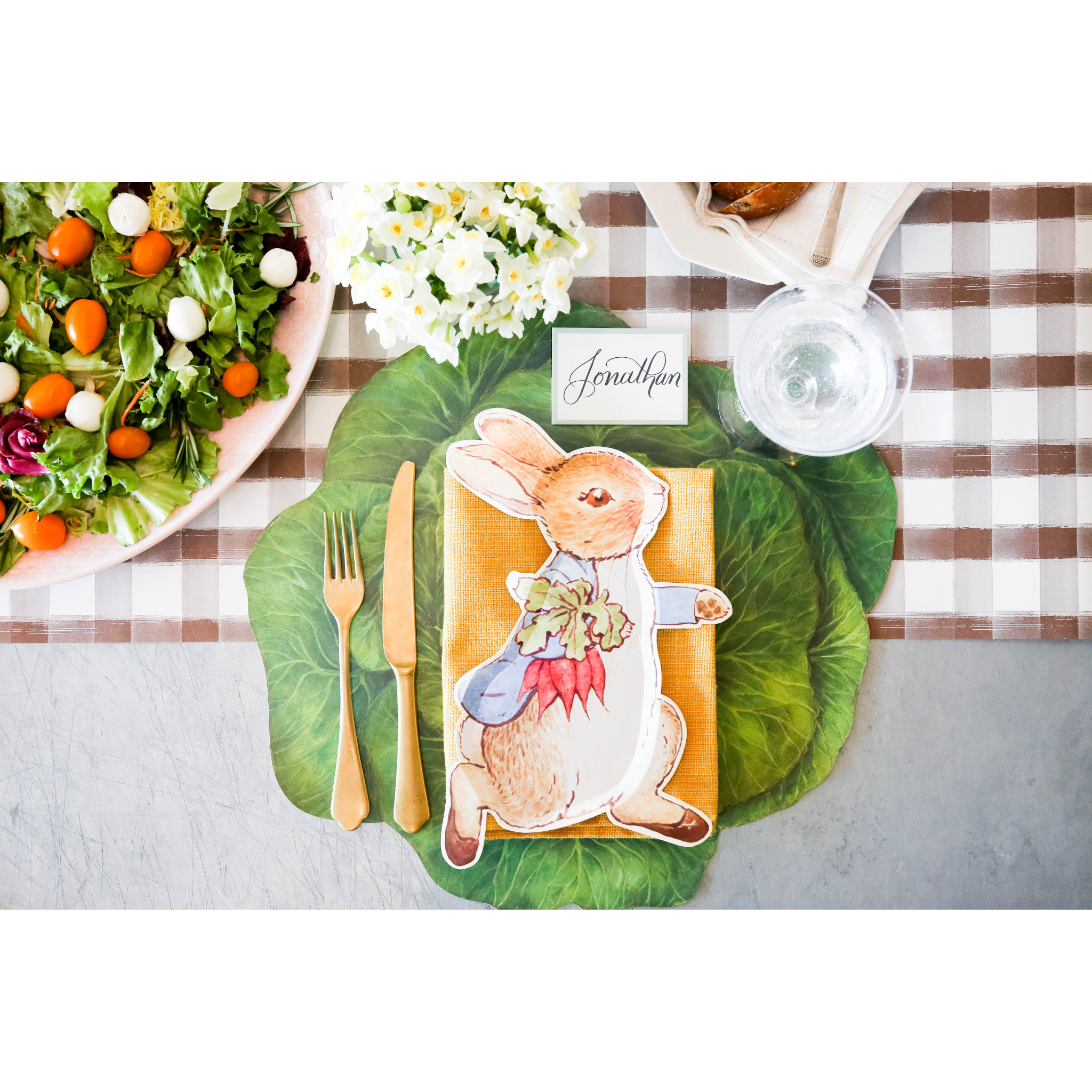 The Die-cut Cabbage Placemat under an Easter-themed place setting, from above.