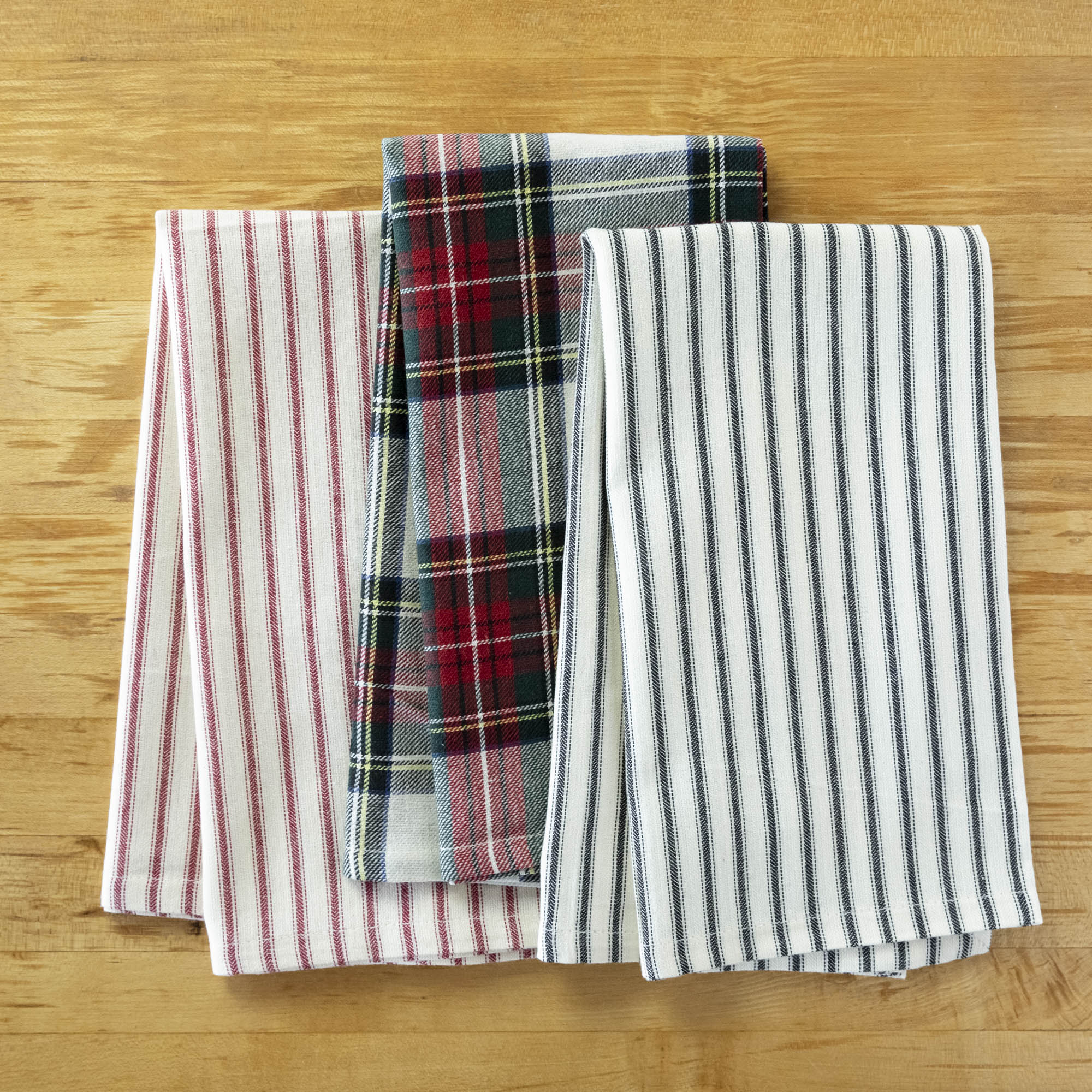 A Taylor Linen Bergen Red Napkin folded on a marble surface for everyday use.