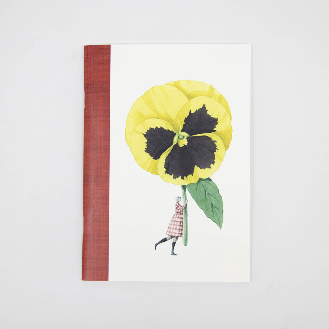 A Hester &amp; Cook In Bloom A5 Wire Stitched Notebook Pansy/Carnation with a creative cover design featuring a large illustrated yellow flower with a human figure integrated into the stem.