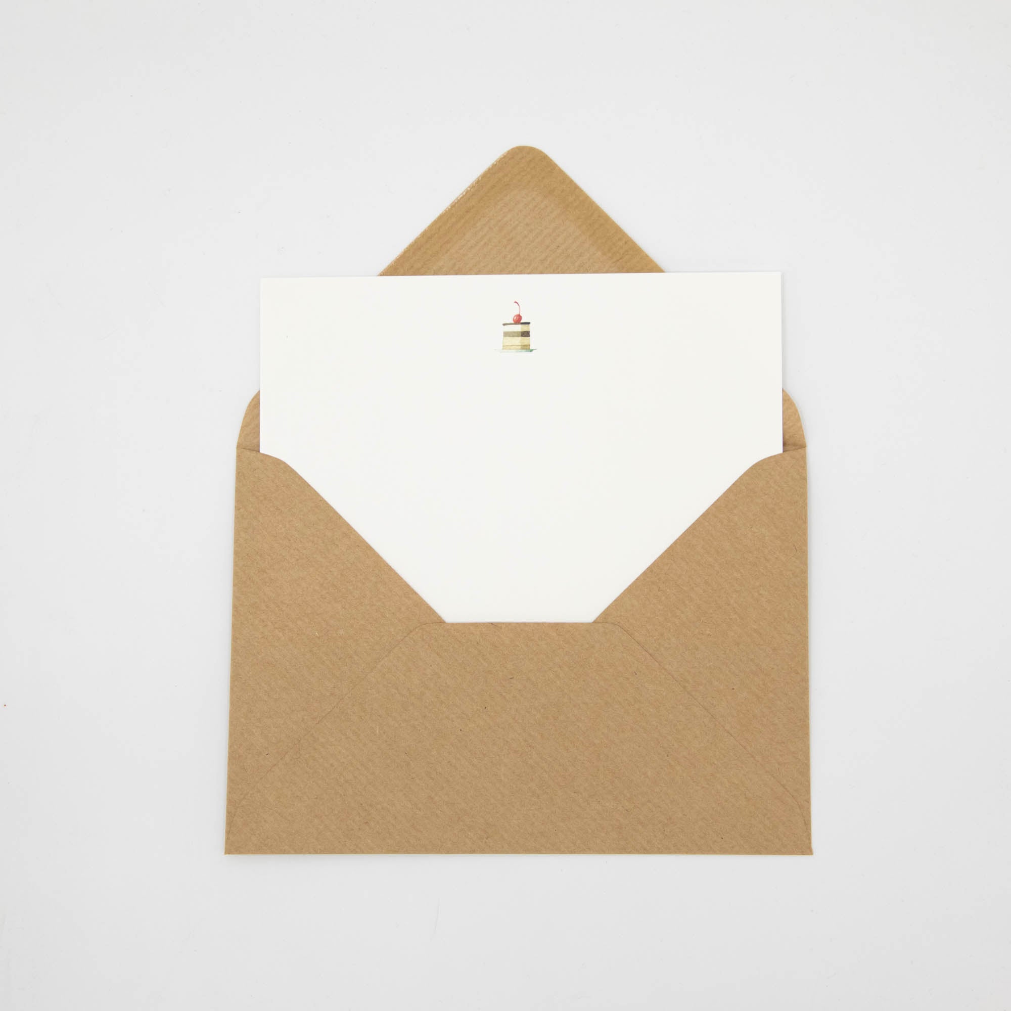 A Cakes Flat Note with a kraft paper envelope, included.