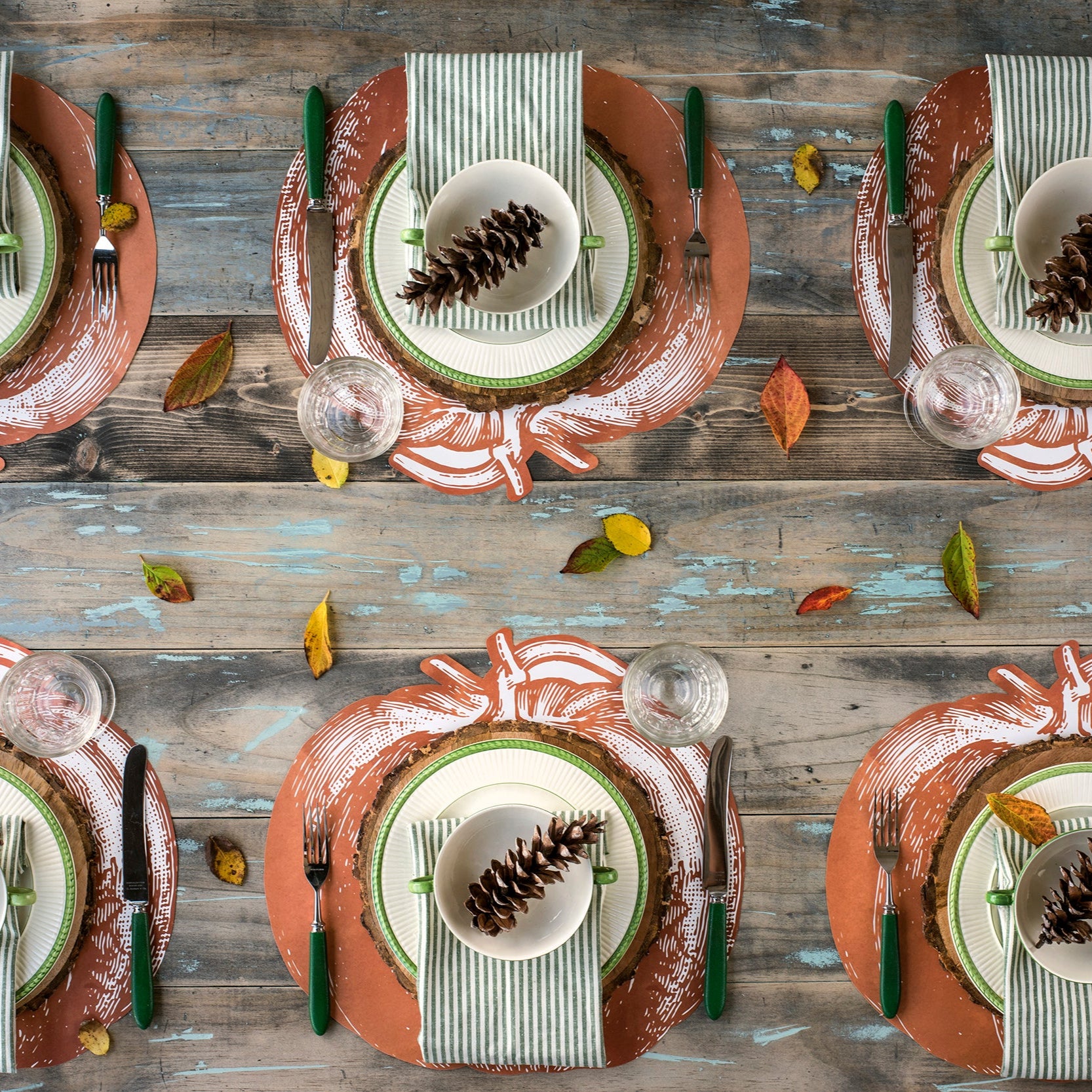The Die-cut Pumpkin Placemat under an elegant fall-themed table setting for six, from above.