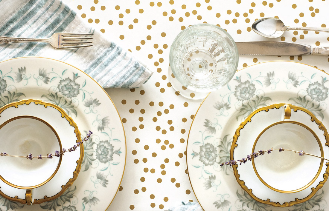 Close-up of the Gold Confetti Runner under an elegant table setting, from above.