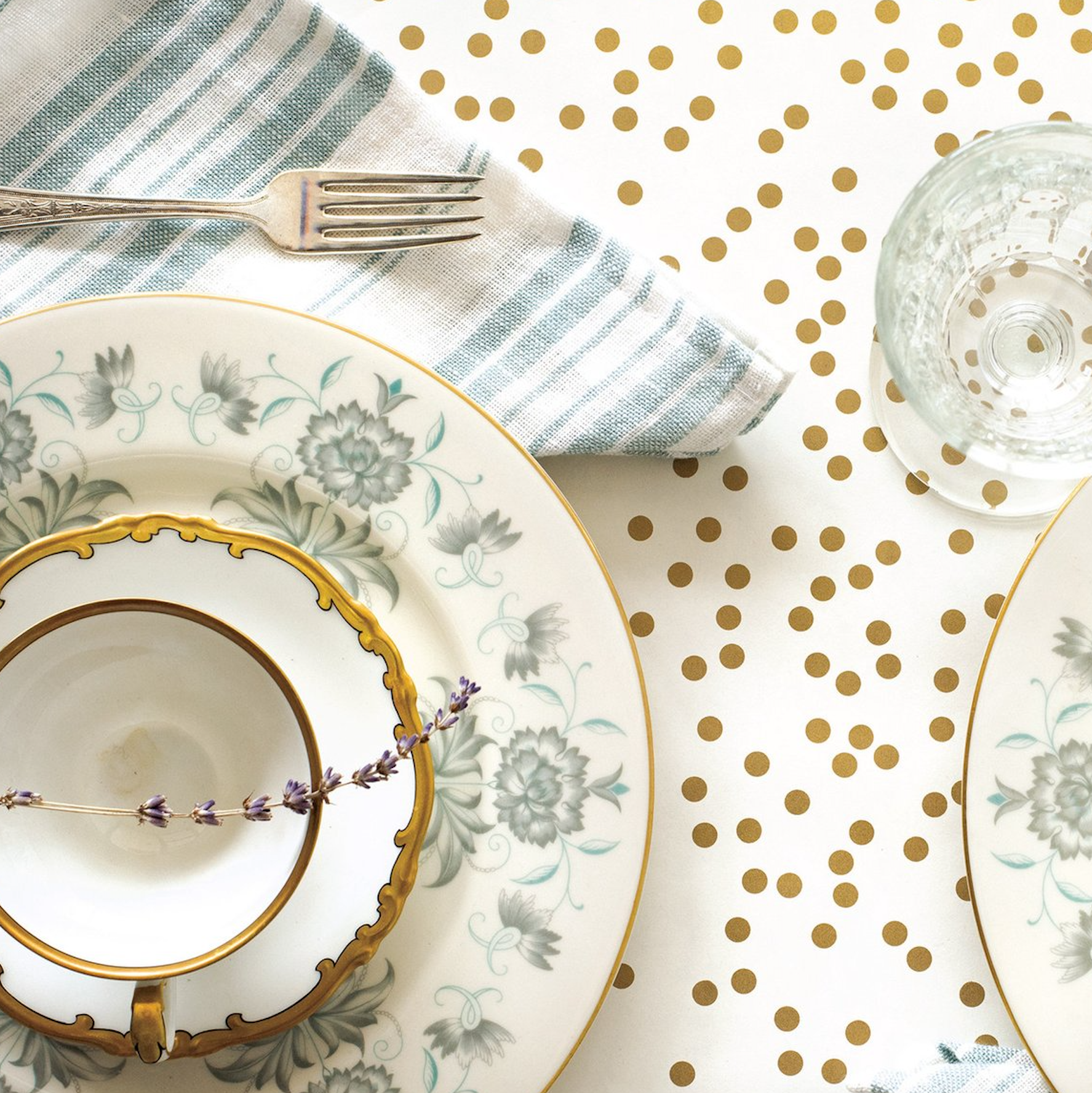 Close-up of the Gold Confetti Runner under an elegant table setting, from above.