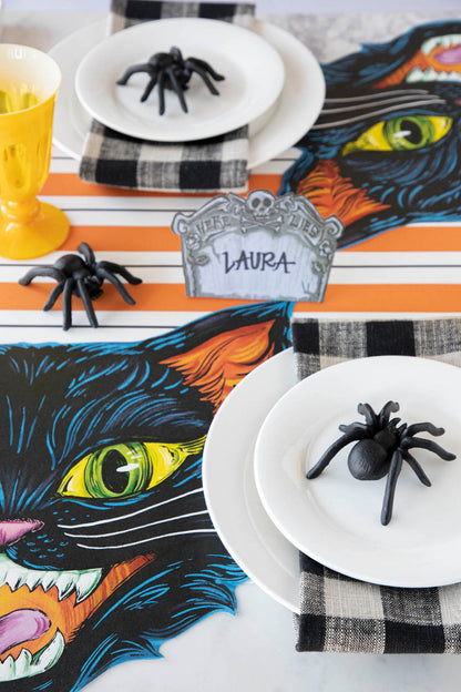 The Orange and Black Awning Stripe Runner under a spooky Halloween-themed tablescape.