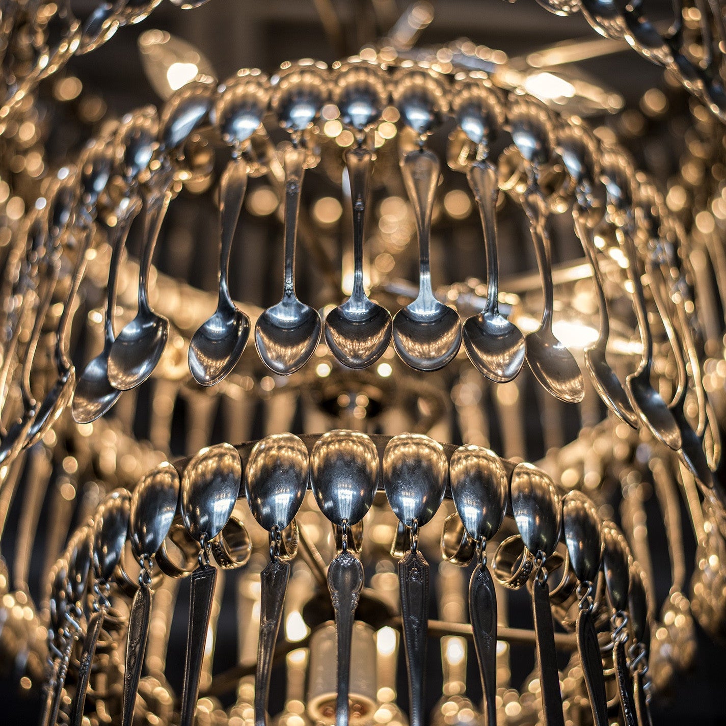 A vintage Quad Tier Spoondelier made out of silver spoons by Hester & Cook.