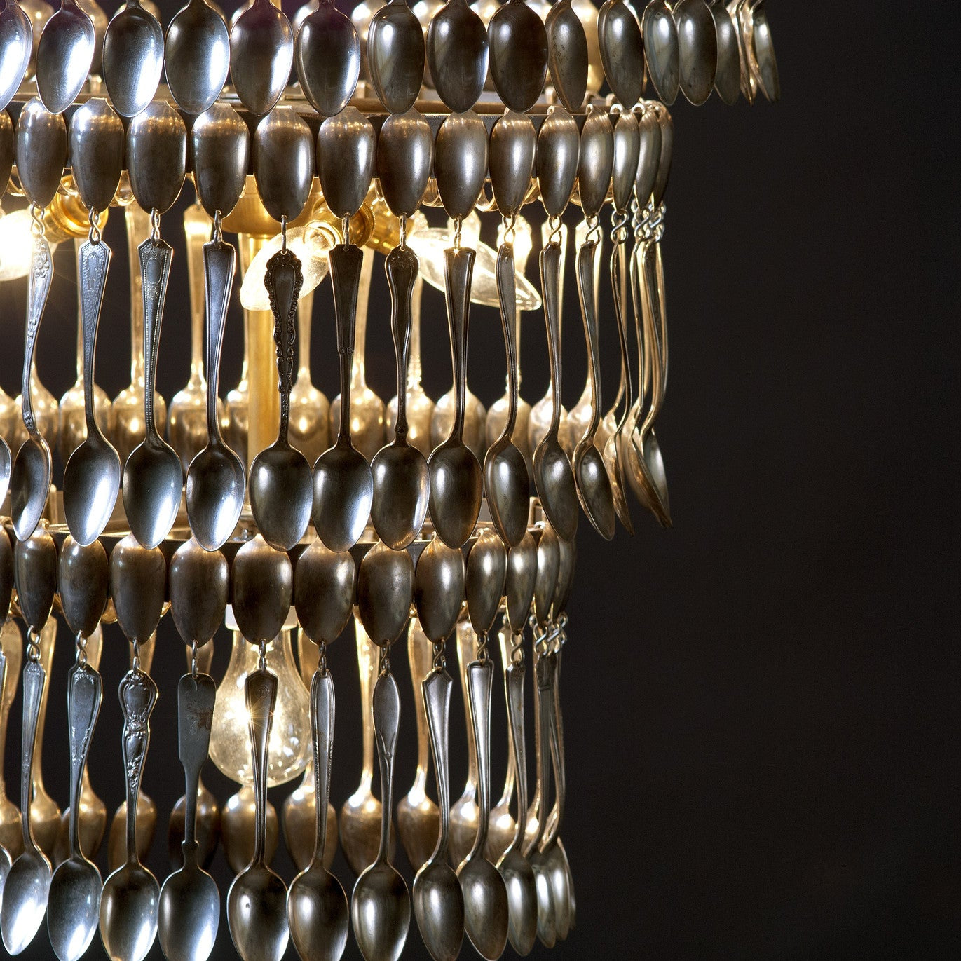 A vintage Quad Tier Spoondelier made out of silver spoons by Hester & Cook.