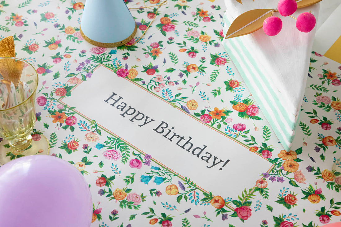 The Sweet Garden Personalized Runner under an elegant Birthday tablescape, with &quot;Happy Birthday!&quot; printed in the middle.