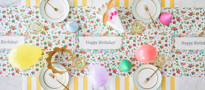 The Sweet Garden Personalized Runner under an elegant Birthday tablescape, with &quot;Happy Birthday!&quot; printed repeatedly in the frames, from above.