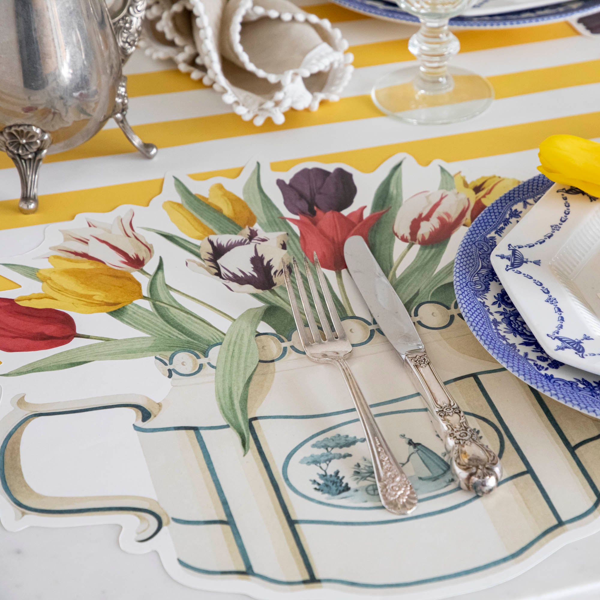 The Die-cut Tulip Teapot Placemat under an elegant springtime place setting.
