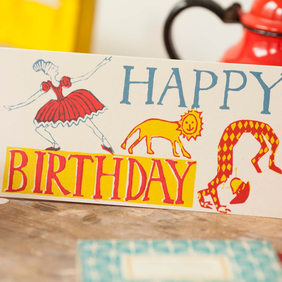 A colorful Happy Birthday Ballerina card with an image of a lion and a clown by Cambridge Imprint.