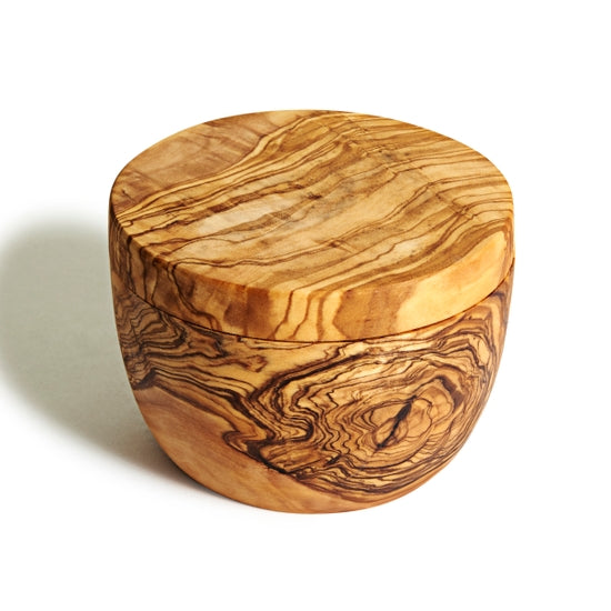 An Natural Olivewood olive wood salt cellar with the rotating lid closed.