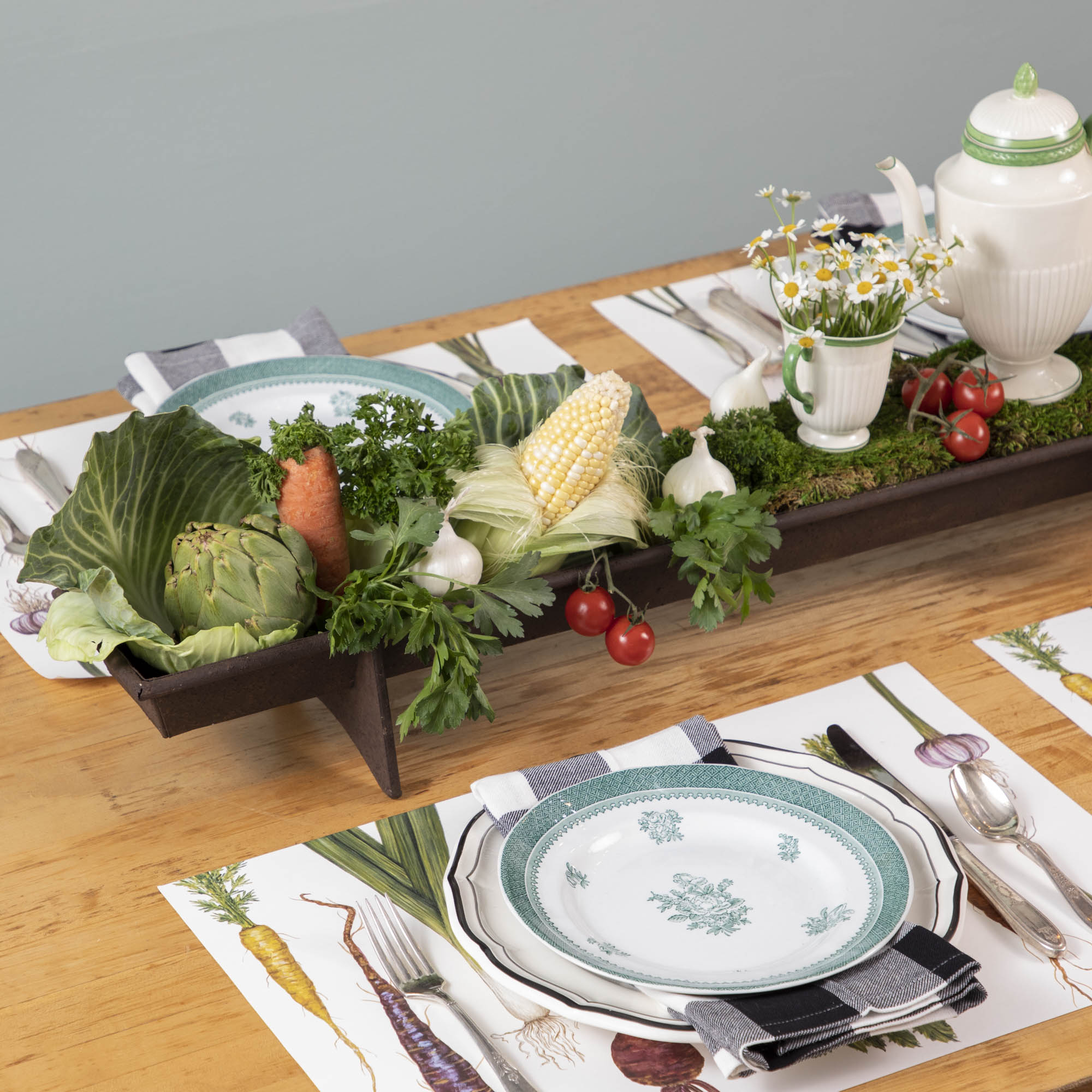 A table with a tray of vegetables on it, featuring a Park Hill Chicken Feeder Centerpiece in rustic style as the centerpiece.