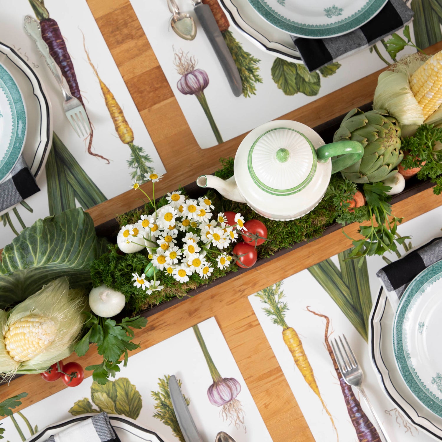 A table with a tray of vegetables on it, featuring a Park Hill Chicken Feeder Centerpiece in rustic style as the centerpiece.