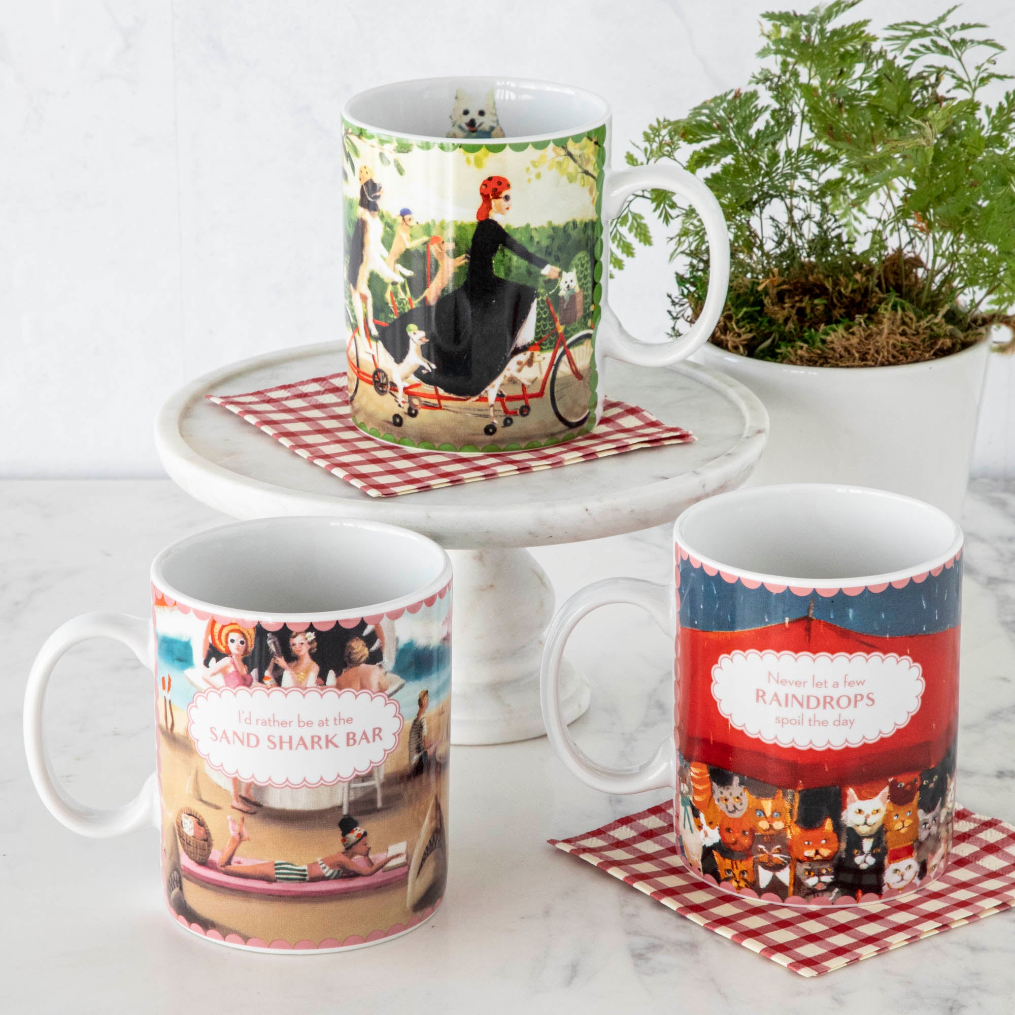 Three Shark Bar Mugs with pictures of cats and dogs on them. (New York Puzzle Company)