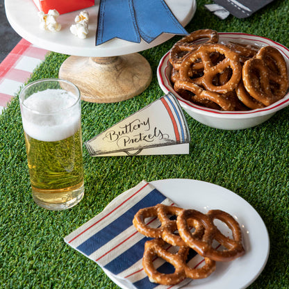 An Artificial Grass Table Runner from Talking Tables and a glass of beer are the perfect addition to any party.